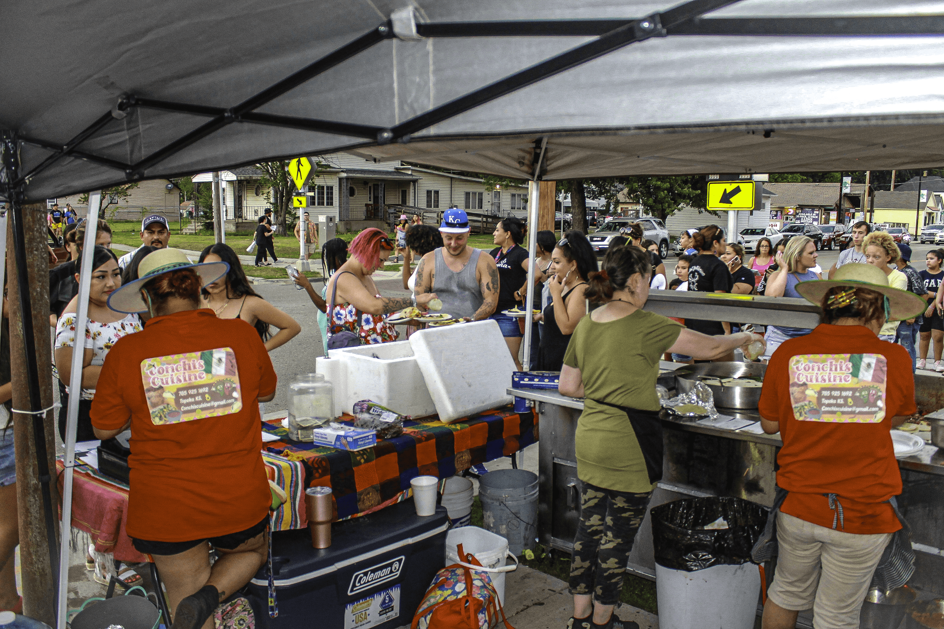 Conchis Cuisine at an event serving, and cooking food